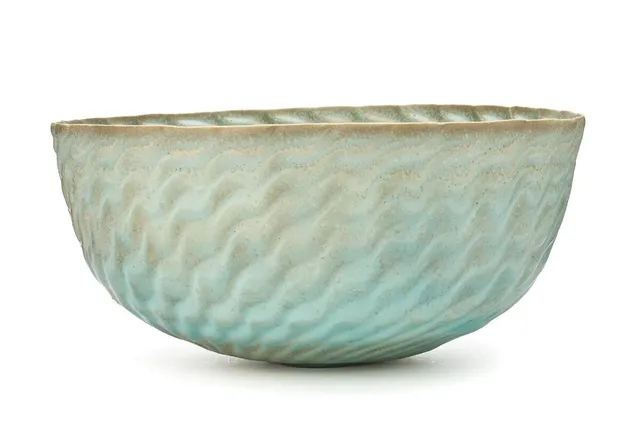 Large stoneware bowl, modelled with relief “waves”. Decorated with pale turquoise glaze. Signed Tove Anderberg, 93. Unique. H. 16 cm. Diam. 33.3–34 cm.
