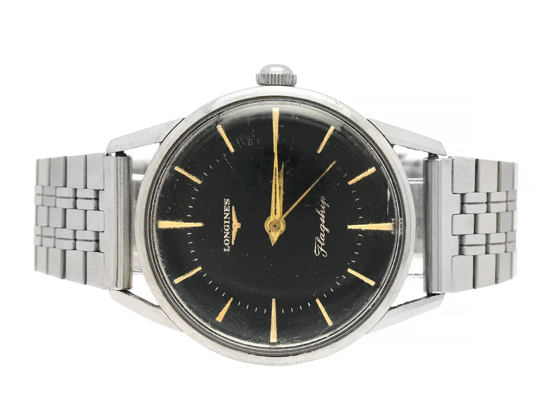 LONGINES, Flagship, Cal 30LS, Serie nr. 11063010, Boett nr. 104 4 / 69, herrur, 35,5 mm, stål, manuell, plexiglas, skadad urtavla, skadad boett (böjt bandhorn), defekt (akut servicebehov, går ej), ca 1960, metallänk ej original. — Klockor/Longines — Kaplans