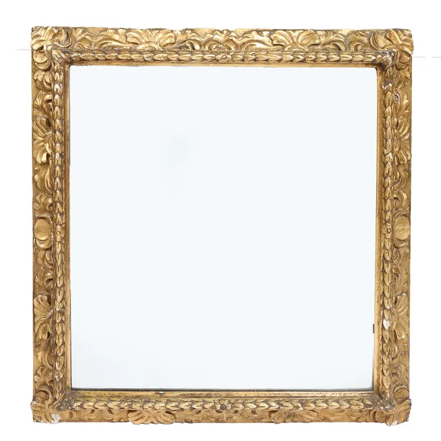 A VICTORIAN GILT GESSO MIRROR.