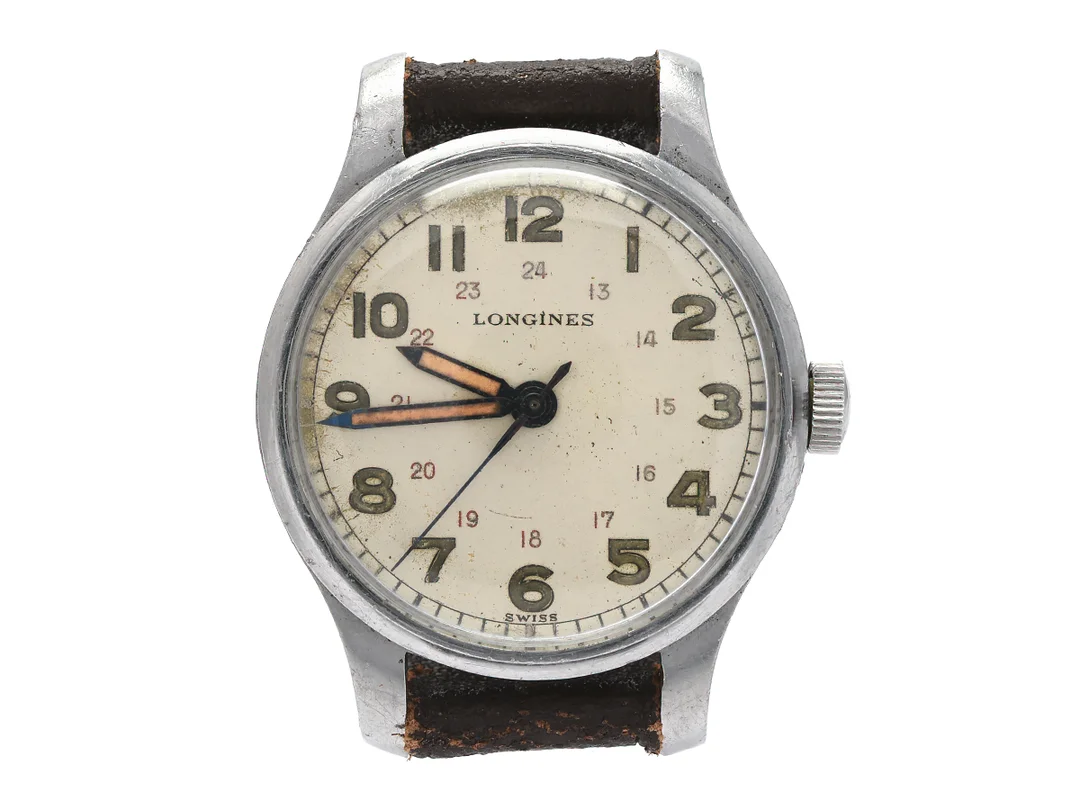 LONGINES, herrur, 32 mm, Cal 12L (12.68 N), Serie nr. 6784256, Boett nr. 22845/246, stål, manuell, plexiglas, skadad urtavla, buckla, läderband, ca 1943. — Klockor/Longines — Kaplans