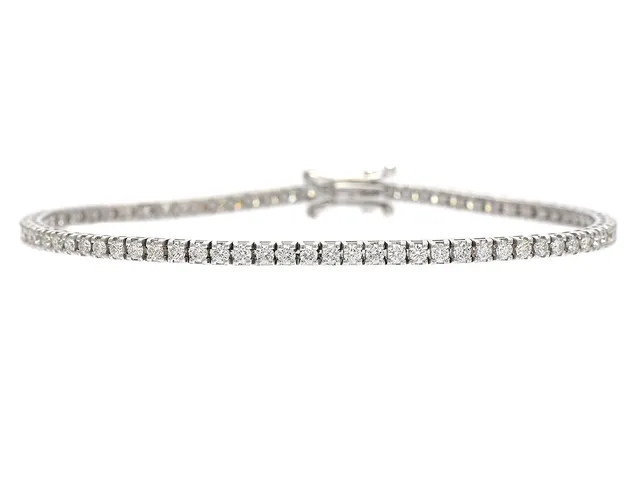TENNISARMBAND, 18K vitguld, 77 briljantslipade diamanter ca 1,59 ctv, ca TW-TCr/VVS-VS, längd 16 cm, vikt 7,2 g.