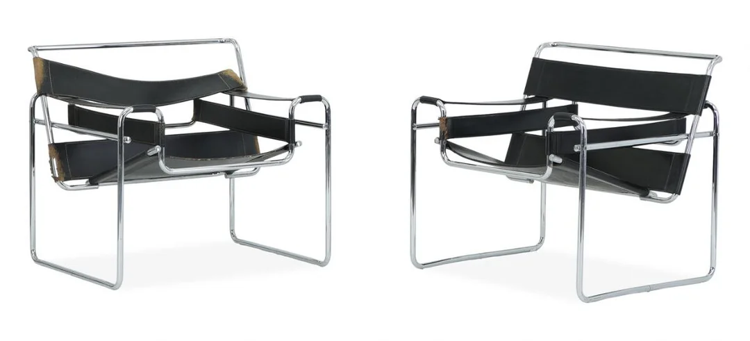 “Wassily Chair”. A pair of chromed tube steel easy chairs. Black grain leather seat back and armrests. Designed 1925. (2) — Modern Furniture — Bruun Rasmussen