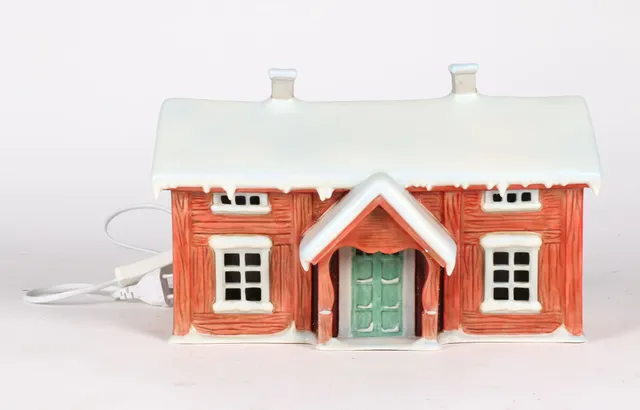 Lars Carlsson for Firkløveren. Porcelain Christmas house with inlaid lights and mechanical slot machine