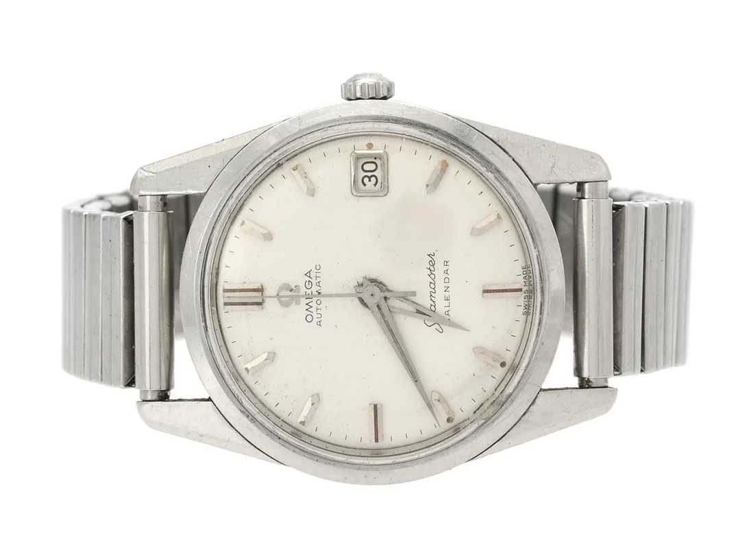 OMEGA, Seamaster, Calendar, Cal 562, Serie nr. 17292627, Ref nr. CK 14701, Boett nr. 14701 1 SC (C.B), herrur, 33,5 mm, stål, automatisk, plexiglas, datum, skadad urtavla/visare, defekt (akut servicebehov, rost) ca 1960, metallänk ej original. — Klockor/Omega — Kaplans