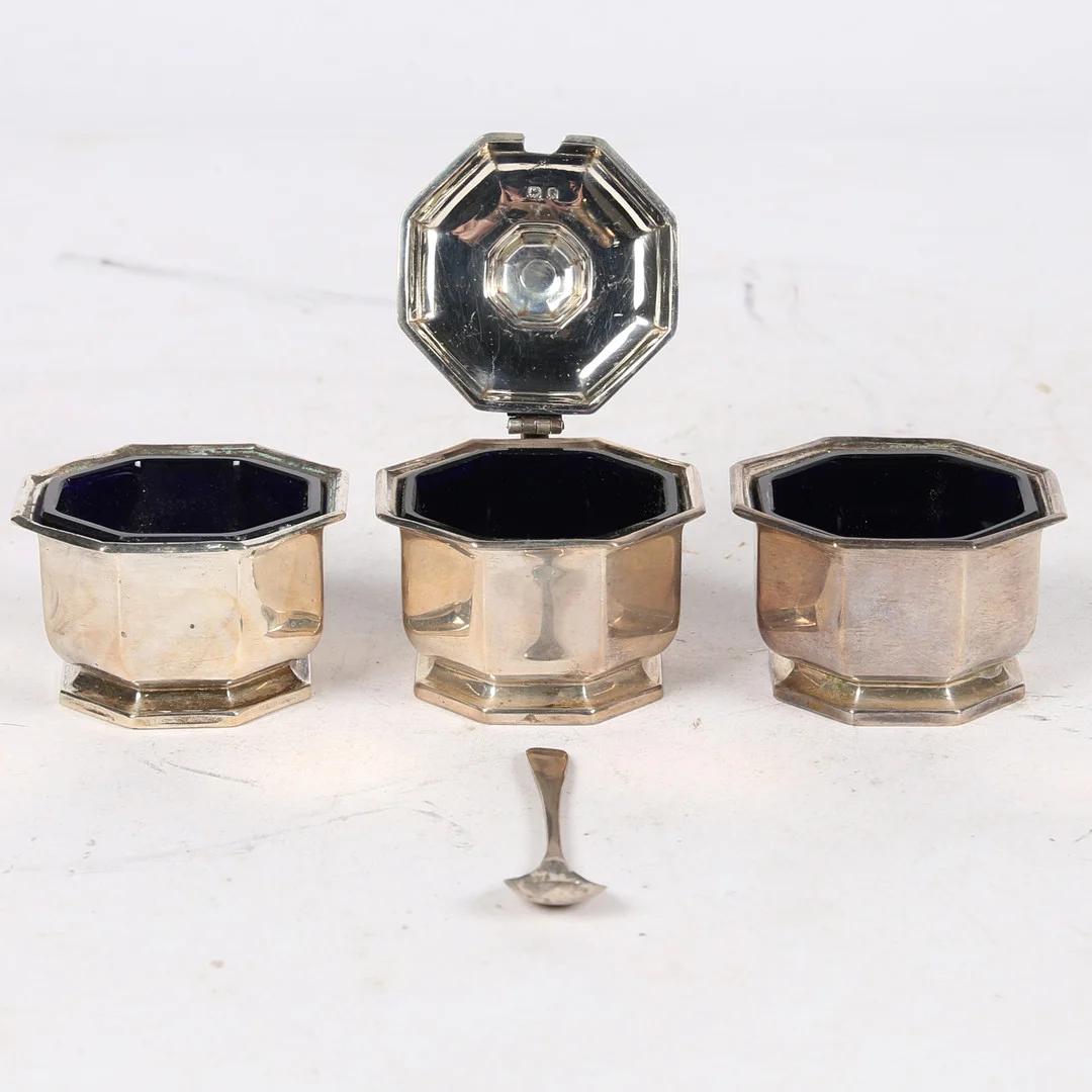 A GEORGE VI SILVER THREE PIECE CONDIMENT SET (3). — Silver — Bishop & Miller