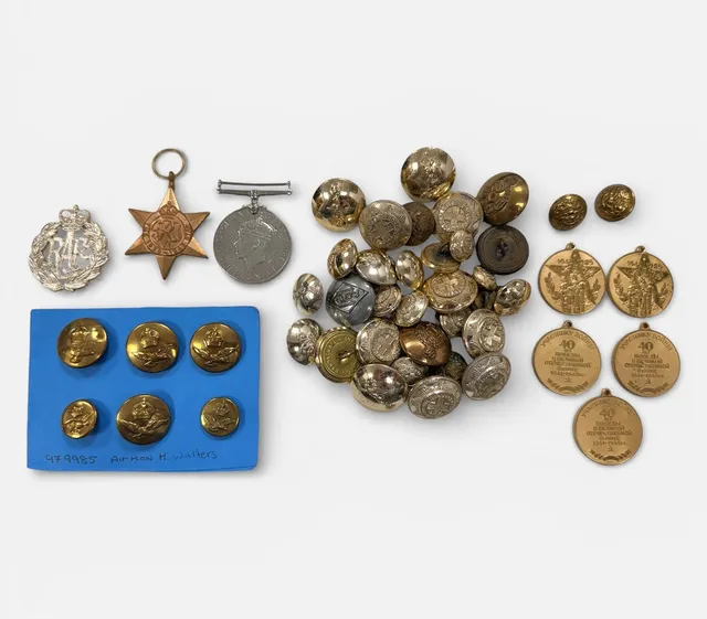 A RANGE OF BUTTONS AND BADGES INCLUDING TWO MEDALS.