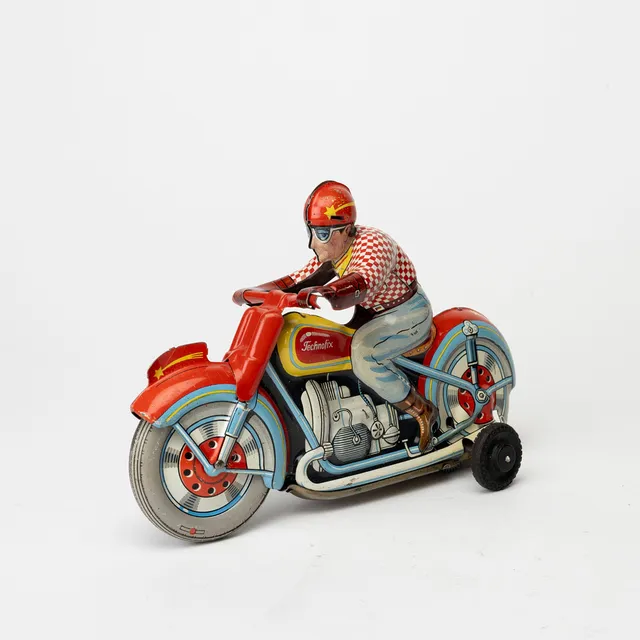 TECHNOFIX motorcykel, plåt, friktion, förare röd-vit tröja, made in Germany 1950-tal.
