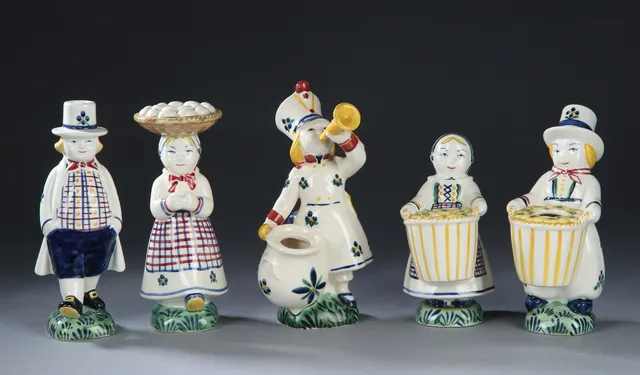 Aluminum. A collection of earthenware Children's Aid Day figurines (5)