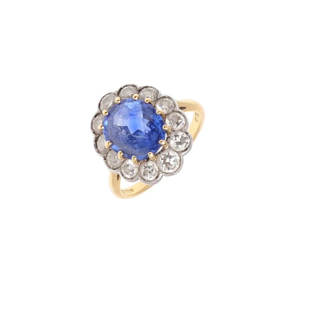 A SAPPHIRE AND DIAMOND CLUSTER RING. — Rings — Lawrences Auctioneers