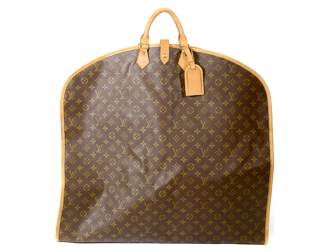ÖVRIGT, LOUIS VUITTON, Housse Porte Habits, monogram canvas, 63x125 cm, 1 st galge, Visst slitage på lädrets kantsömmar. — Accessoarer/Övrigt — Kaplans
