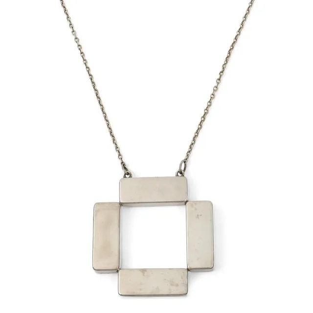 A necklace set with a square pendant, mounted in sterling silver. Design no. 379. Weight app. 39.5 g. L. app. 54 cm. Made by Georg Jensen in the early 1970s.