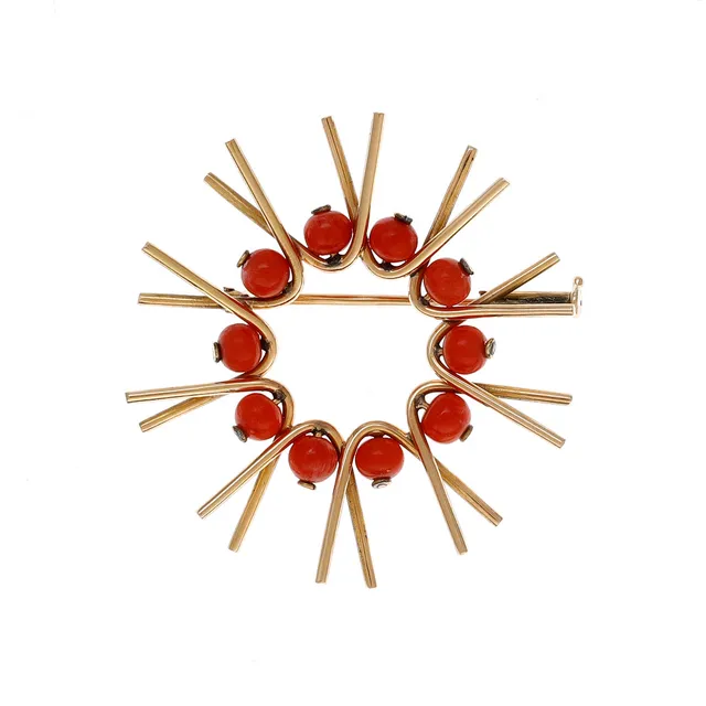 Gold and coral brooch, circa 1960.