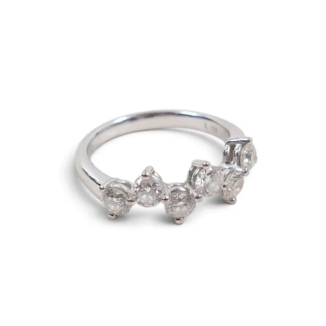 A SIX STONE DESIGNER DIAMOND RING.