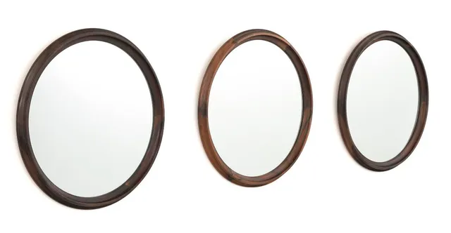 Set of three circular mirrors of Brazilian rosewood. Made by Luxus, Sweden. 1960s. Diam. 48.5. (3)