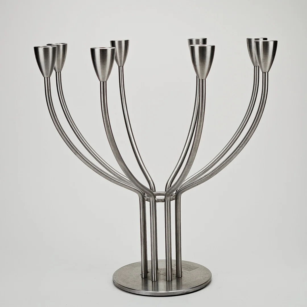 MARIANNE OCH KNUT HAGBERG. Kandelaber, för 8 ljus, rostfritt stål, "Stockholm", IKEA. — Candlesticks — Auktionshuset Thörner & Ek