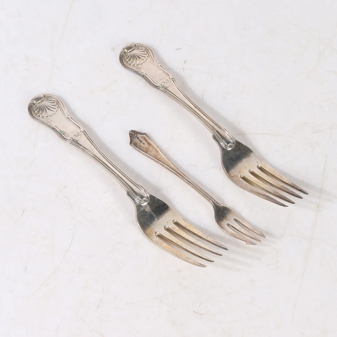 TWO GEORGE III SILVER TABLE FORKS, AN EDWARD VIII SILVER PICKLE FORK (3). — Silver — Bishop & Miller
