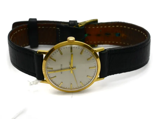 Herrur Helvetia 18K manuell, repigt plastglas, med slitet läderarmband brvikt 32,6g