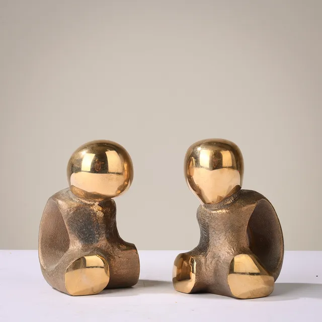 ERLING ANDERSEN (F.1937). "Optimist" og "Pessimist", et par skulpturelle bogstøtter i bronze, Danmark, 1900-tallets anden halvdel, (2).