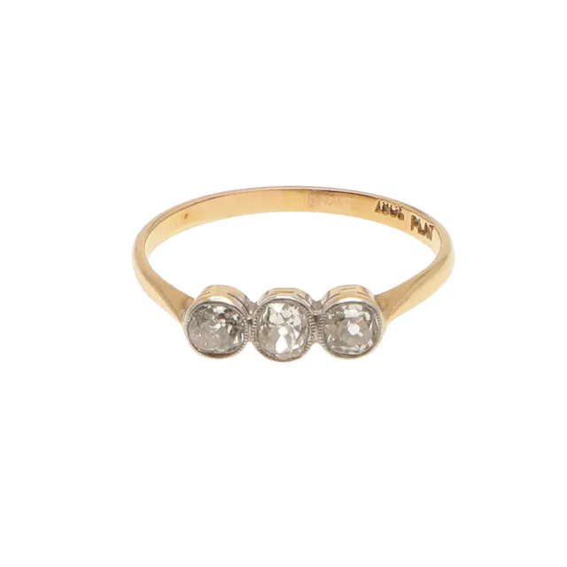 A DIAMOND THREE STONE RING.