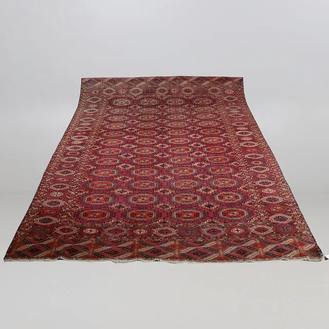 A TEKKE TURKMEN CARPET, EMIRATE OF BUKHARA, CIRCA 1900.