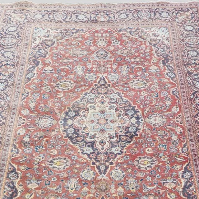 A PERSIAN CARPET OF KASHAN DESIGN.