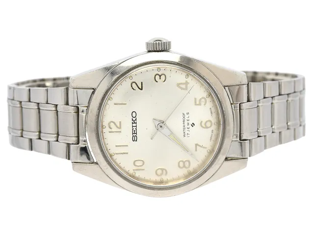 SEIKO, unisex, 31,5 mm, Cal 66A, Serie nr. 801530, Boett nr. 66-7070, stål, manuell, plexiglas, skadad urtavla, defekt, OBS: verkhållarskruvar saknas, ca 1968, metallänk ej original.