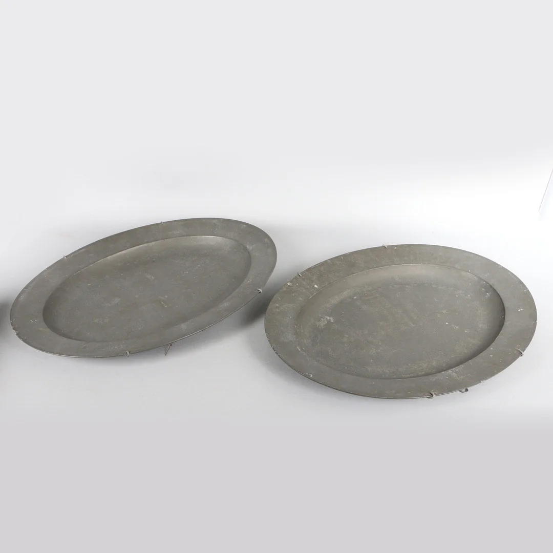 TWO LARGE OVAL PEWTER MEAT PLATES BY JOSEPH SPACKMAN I OF CORNHILL, LONDON, C.1770 (2). — Pewter, Brass & Copper — Bishop & Miller