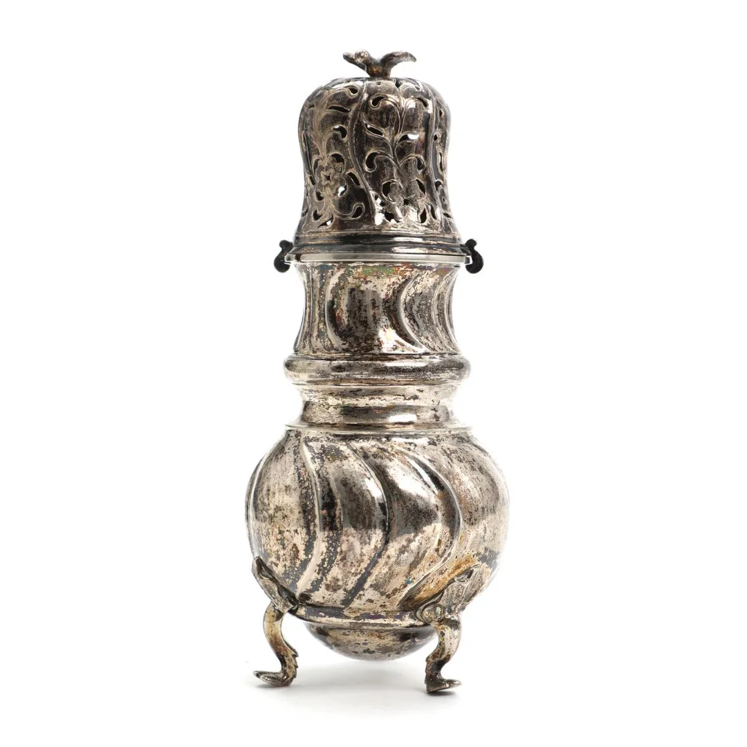 A Danish Rococo fluted silver caster of baluster form, pierced lid with finial in the form of a bird, standing on three cabriole legs with leaf ornaments. Master Andreas Krag, trade licence Næstved 1759. Weight approx. 198 g. H. 16.5 cm. — Silver/Silver — Bruun Rasmussen