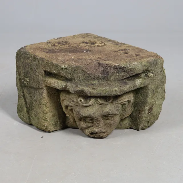 A MEDIEVAL STONE CORBEL.
