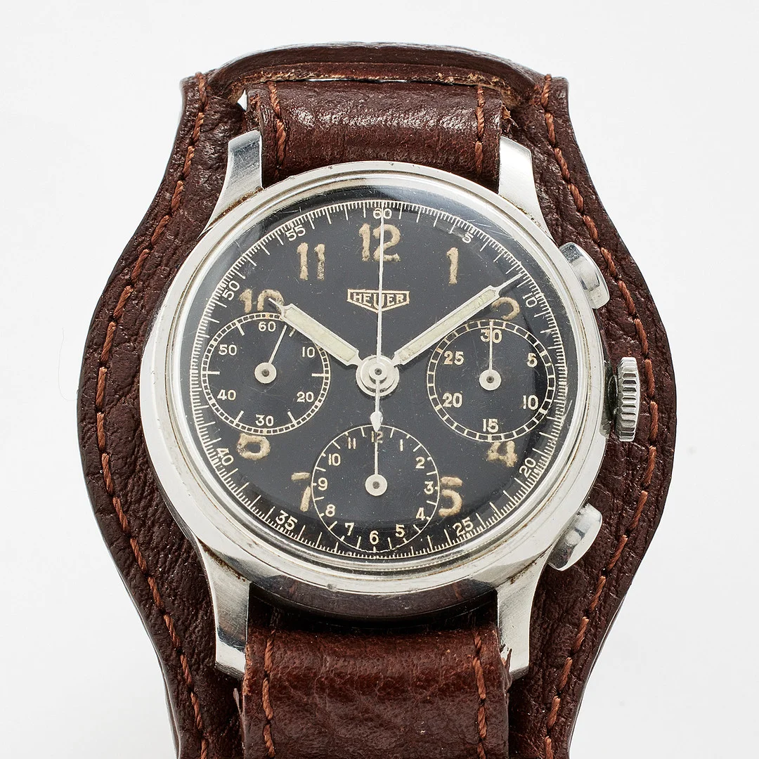 HEUER, a steel wristwatch, 1940s. — Wristwatches — Stockholms Auktionsverk Fine Art