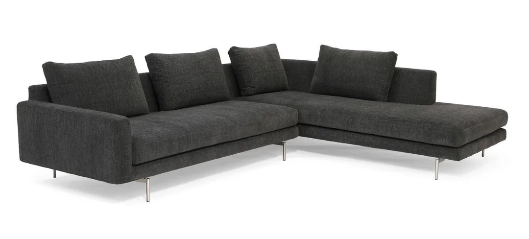 “Edge”. Modular sofa with powder-coated steel legs, seat, backrest, armrests, and loose cushions upholstered in dark grey fabric. Manufactured by Wendelbo. — Modern Furniture — Bruun Rasmussen