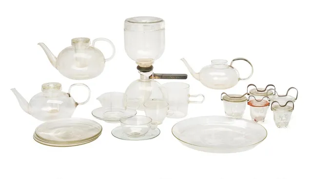 Bauhaus glass tea and coffee service and pressed glass tableware. Designed primarily in the 1930s. Produced and marked by Jenaer Glas; some pieces marked Schott & Gen., Jena Therm, and Saale Glas. East and West Germany. Also 10 pieces of tableware that are unmarked or marked WMF. (84+10)