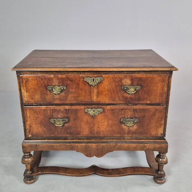 EARLY 18TH CENTURY AND LATER WALNUT CHEST ON STAND.