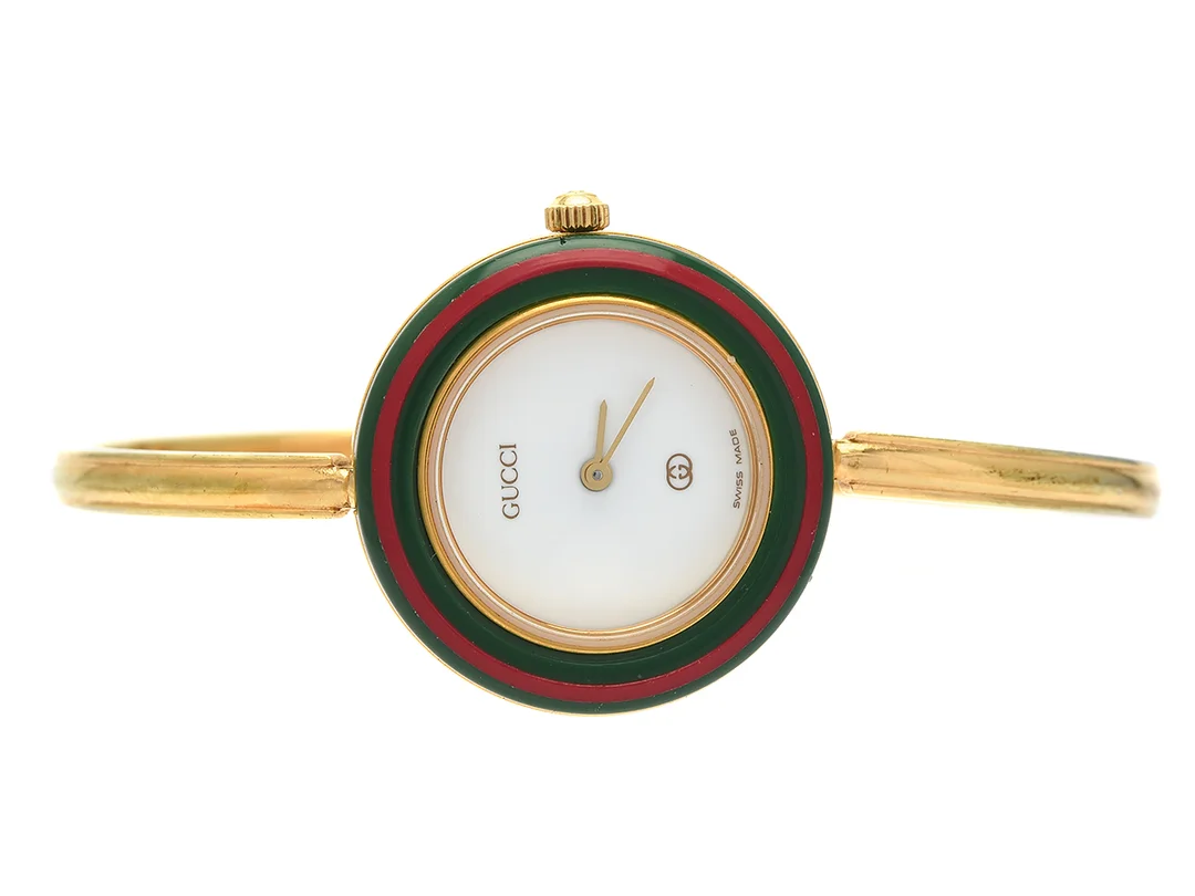 GUCCI, damur, 26 mm, Serie nr. 0152147, Boett nr. 1100-L, doublé, quartz, mineralglas, skadad urtavla, defekt, 12 st. utbytbara ringar, integrerad originallänk, längd 155-160 mm, ca 1995, box. — Klockor/Gucci — Kaplans