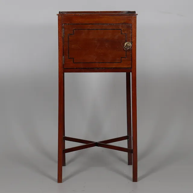 A MAHOGANY AND EBONISED INLAID POT CUPBOARD.