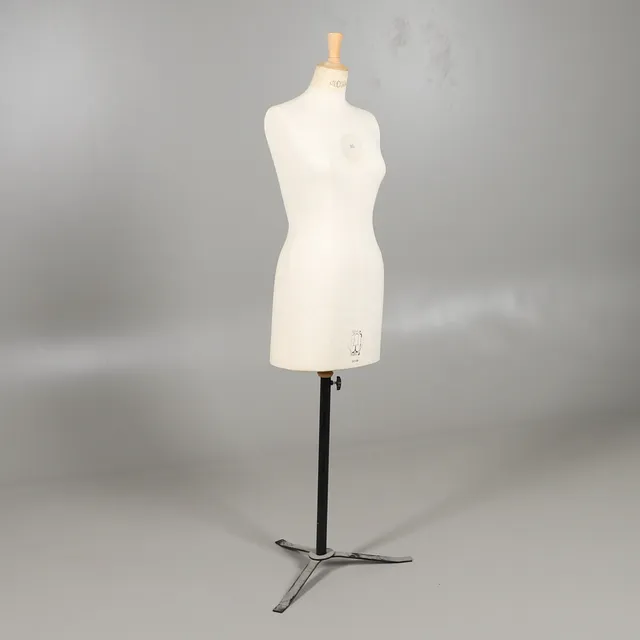 A MANNEQUIN ON STAND.