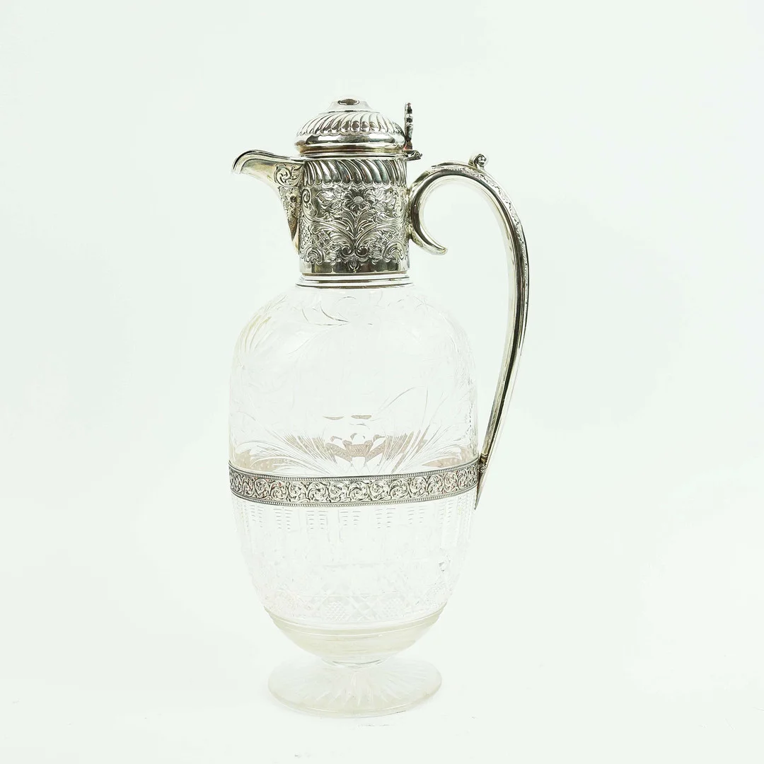 A VICTORIAN CUT GLASS AND SILVER MOUNTED CLARET JUG. — Silver — Lots Road Auctions