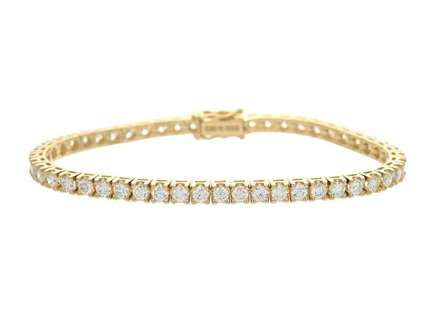 TENNISARMBAND, 18K guld, 49 briljantslipade diamanter ca 4,40 ctv, ca TW-TCr/VVS-VS, längd 16 cm, vikt 13,7 g.