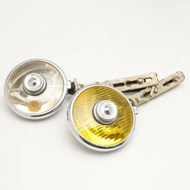 A PAIR OF BUTLERS SAUCER DRIVING LIGHTS.