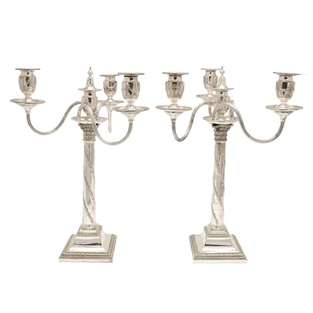 A PAIR OF SILVER PLATED THREE BRANCH CANDELABRA.
