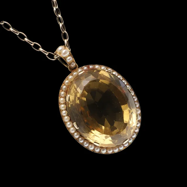 A CITRINE AND CULTURED PEARL PENDANT.