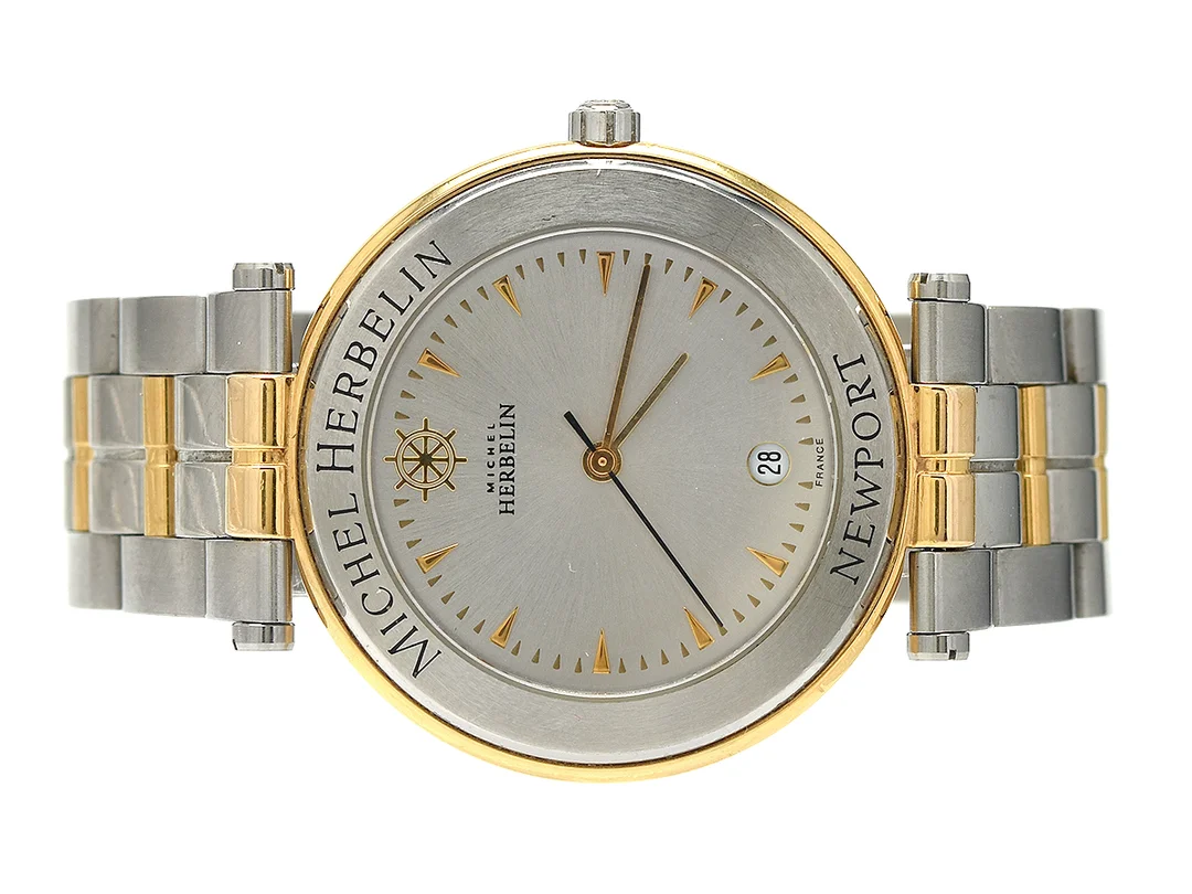 MICHEL HERBELIN, Newport, Boett nr. 12486.BS2, herrur, 35 mm, bicolour, quartz, safirglas, datum, skadad urtavla, integrerad länk, viklås, längd 160 mm, ca 2005, box, ytterkartong (skadad). — Klockor/Michel Herbelin — Kaplans