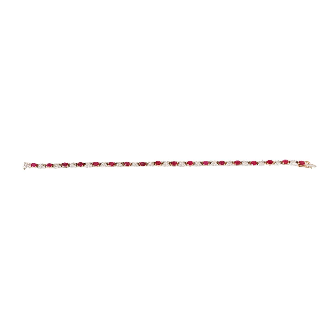 A 9-CARAT GOLD RUBY AND DIAMOND SET BRACELET. — Bracelets — Bishop & Miller