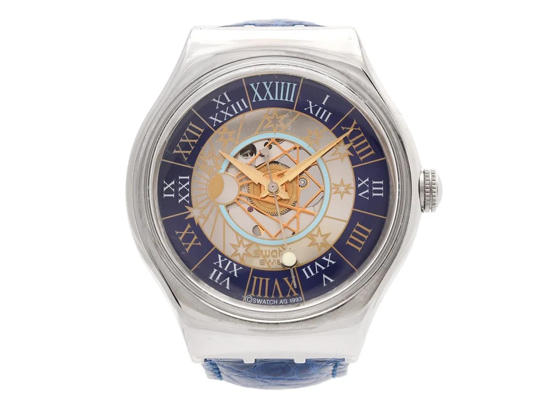 SWATCH, Special, Tresor Magique, Cal ETA 2840, Ref nr. SAZ101, Nr. 12417/12999, herrur, 36 mm, platina, automatisk, plexiglas, glasbaksida, integrerat läderband, originalspänne i stål, ca 1993, specialbox i metall. — Klockor/Swatch — Kaplans