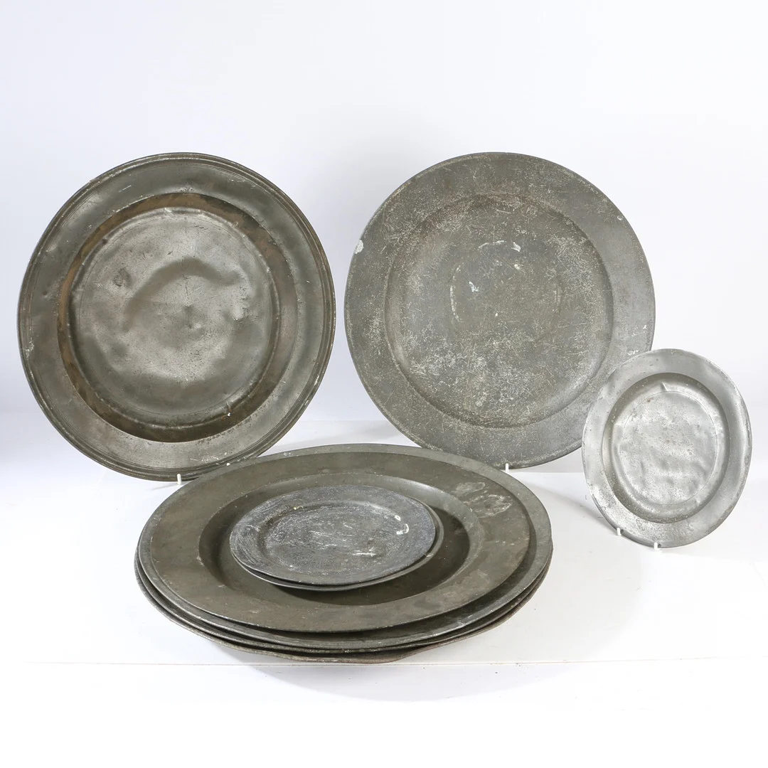 A COLLECTION OF 18TH AND 19TH CENTURY PEWTER PLATES AND CHARGERS (9). — Pewter, Brass & Copper — Bishop & Miller