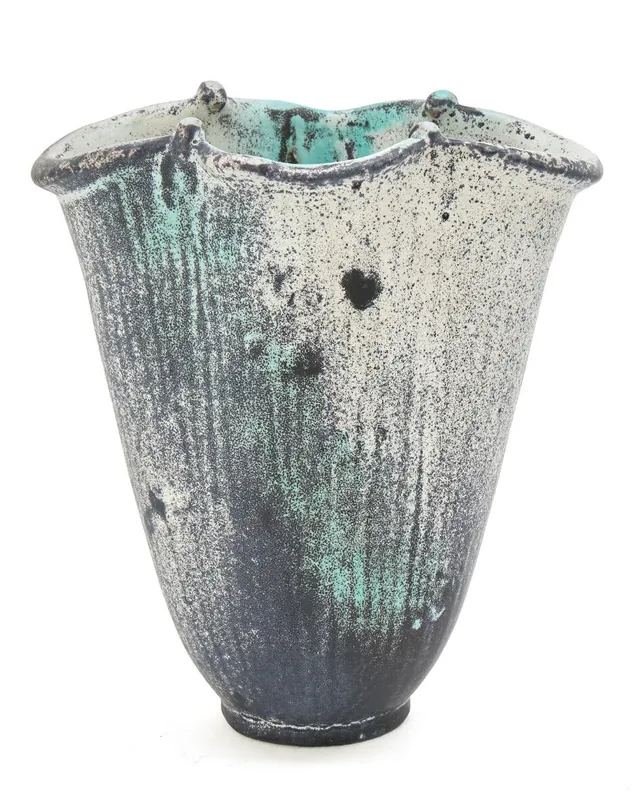 Earthenware vase modelled in oval shape. Decorated with black, white and turquoise glaze. Signed HAK. Manufactured by Kähler. H. 21 cm. W. 13 cm. D. 18.5 cm.