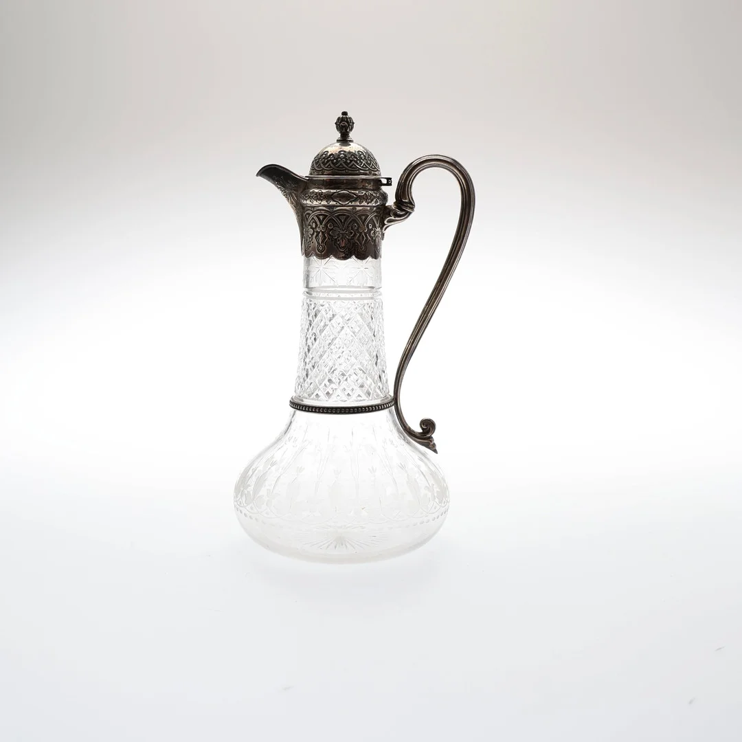 VICTORIAN SILVER MOUNTED CUT AND ENGRAVED GLASS CLARET JUG. — Silver — Young's Auctions