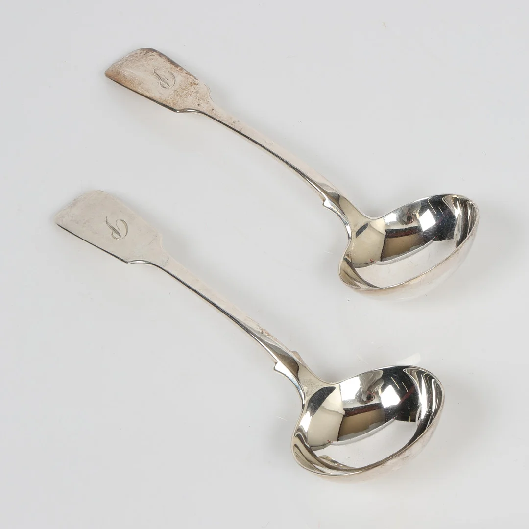 A PAIR OF VICTORIAN SILVER LADLES (2). — Silver — Bishop & Miller