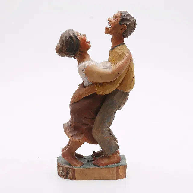 OTTO JANSSON. Skulptur, dansande par, snidat och bemålat trä, signerad och daterad 1921.