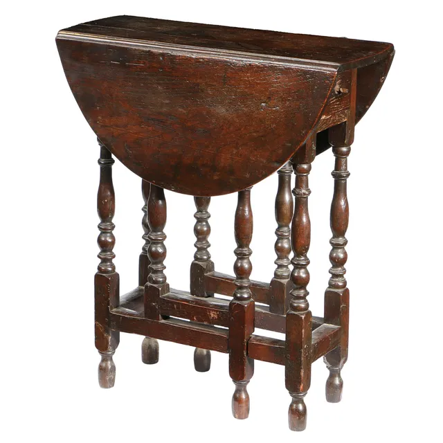A SMALL CHARLES II OAK DROP LEAF TABLE, CIRCA 1680.